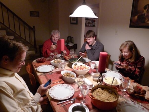 This picture of a wonderful family giving thanks for all their blessings at Thanksgiving dinner: