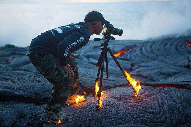 Photographer Gets So Close to Lava That His Shoes and Tripod Catch on Fire burning