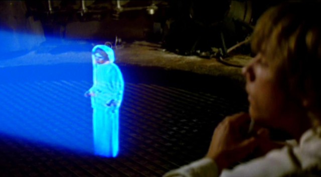 Princess Leia hologram, looked on at by a lustful Luke Skywalker