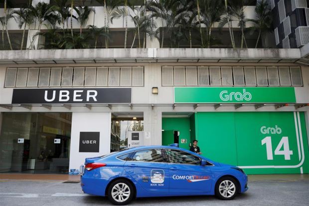 Cho rằng thỏa thuận Grab-Uber gây thiệt hại cho người tiêu dùng, Singapore đề xuất các hình phạt mạnh tay - Ảnh 3.