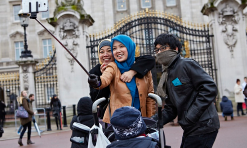 Generic selfie stick being used outside a famous British tourist attraction