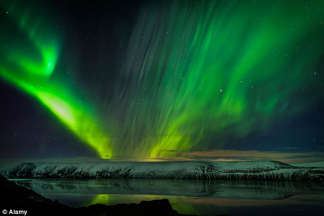 The Aurora Borealis (shown above) is caused by photons particles thrown out by gas atoms high in the Earths atmosphere as they collide with high energy charged particles carried by the solar wind from the sun