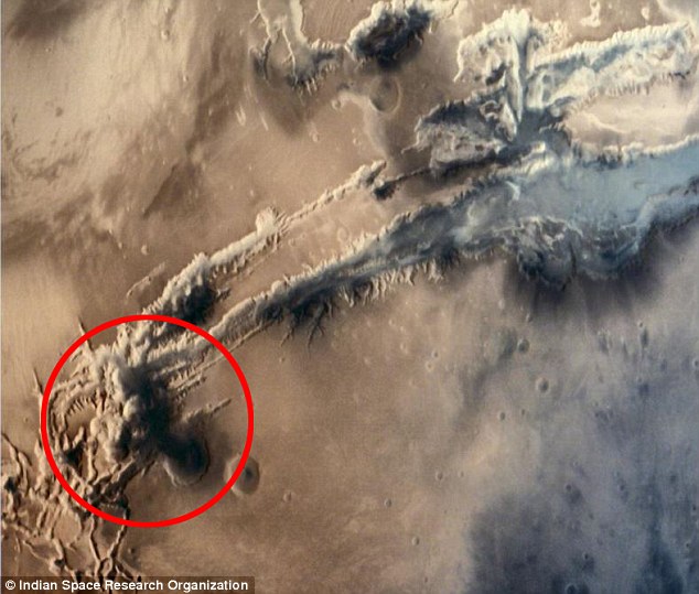 A striking image that allegedly shows a mushroom cloud (circled red) rising on Mars has been pounced on by conspiracy theorists. Alien forums say the image is &apos;evidence&apos; that a civilisation may have been wiped off the Martian surface as a result of nuclear war