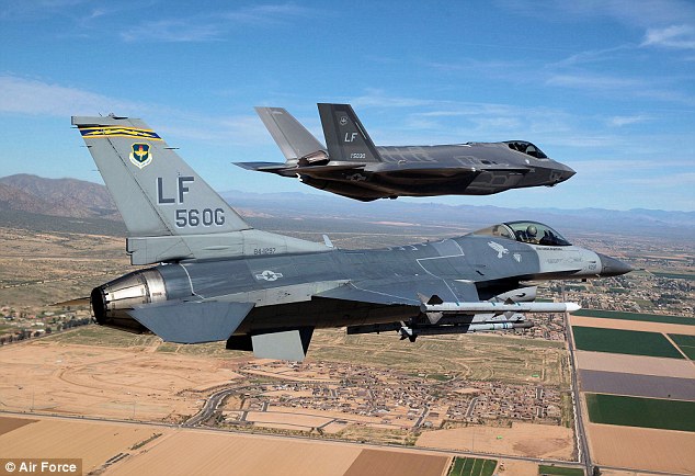 Head-to-head: The F-35 (background) and the F-16 (foreground) took to the skies in a dogfight to determine how the highly-anticipated F-35 compares to its predecessor