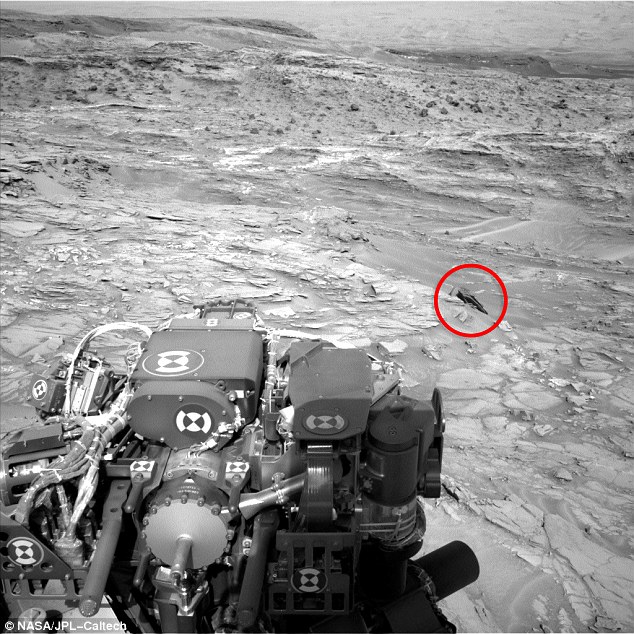 &apos;I found this anomaly in the latest Curiosity Rover photo. The black object looks like a crashed UFO,&apos; wrote UFO Sightings contributor Scott Waring. He said the &apos;craft&apos; is only about 2.5 to 3 metres across, &apos;so it probably only held a few passengers&apos;