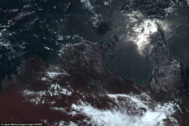 The stunning 11,000 x 11,000 pixel shot reveals a huge amount of detail. Here can be seen the north coast of Australia, with the suns light glinting in the Arafura Sea, while wisps of clouds can also be seen at the bottom of the image