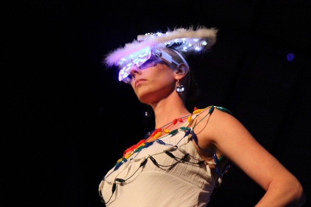 Why not wear a head piece with lights paired with a christmas light necklace? Glasses by Tenaya Hurst