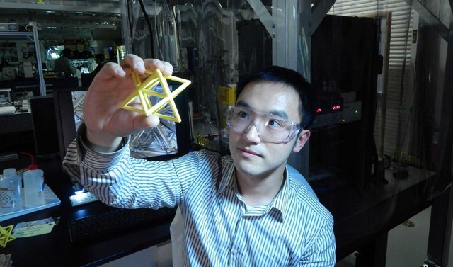 Lawrence Livermore Engineer Xiaoyu Rayne Zheng studies a macroscale version of the unit ...