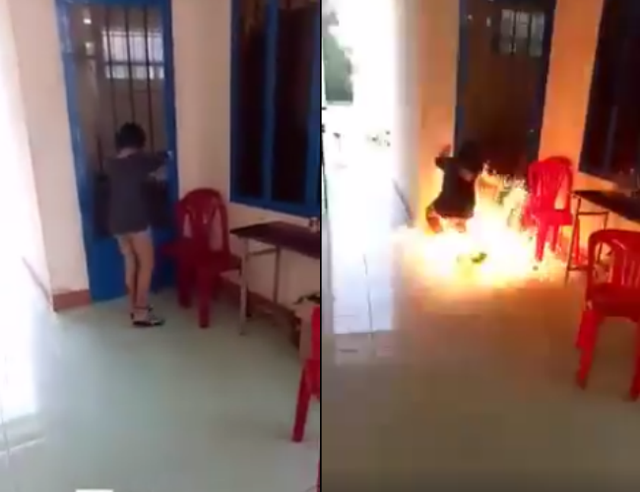 Nữ sinh châm lửa đốt ngay trước cửa phòng y tế của trường. Ảnh cắt từ clip