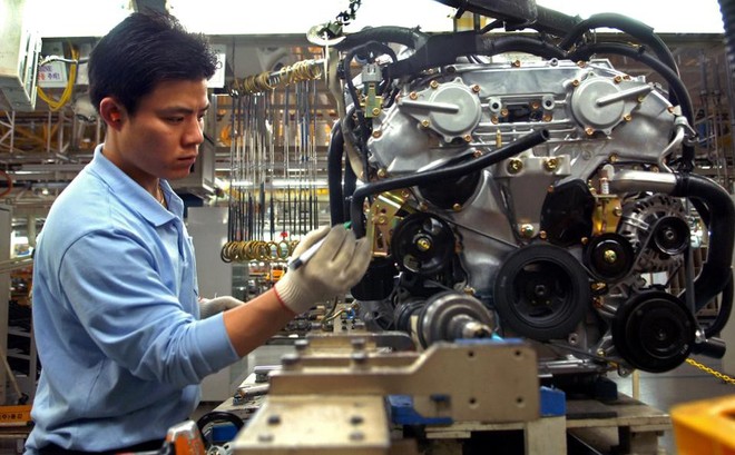 
Công nhân tại phân xưởng lắp ráp xe hơi Renault Samsung Motors tại Busan, Hàn Quốc
