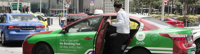Cho rằng thỏa thuận Grab-Uber gây thiệt hại cho người tiêu dùng, Singapore đề xuất các hình phạt mạnh tay - Ảnh 1.