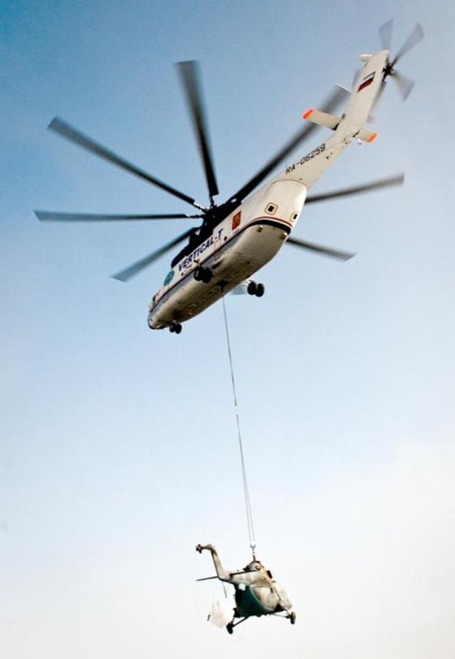 Khám phá trực thăng khổng lồ Mi-26 của Nga: Đã từng chở hóa thạch voi ma mút và máy bay chở khách cỡ nhỏ - Ảnh 3.