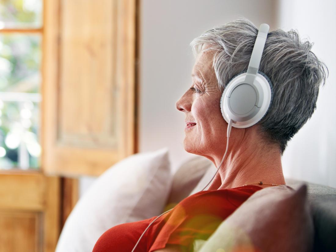 a-woman-listening-to-a-binaural-beats-recording-on-headphones.jpg