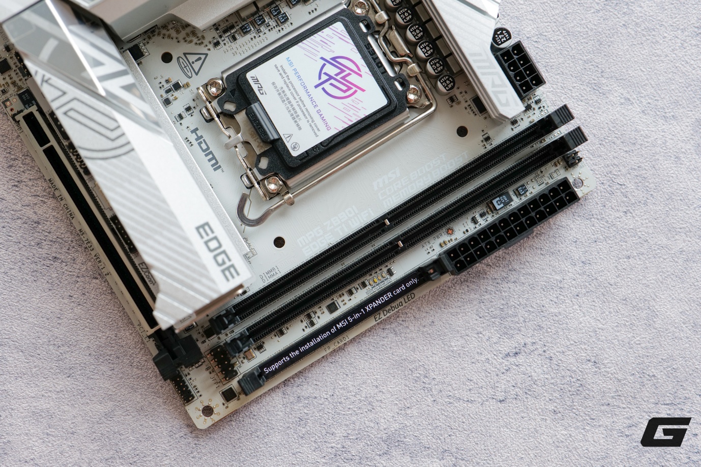 Mở hộp MSI MPG Z890I EDGE TI WIFI: Tông trắng cho những cấu hình nhỏ nhắn- Ảnh 9. A close-up of a computer motherboard AI-generated content may be incorrect.