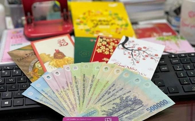 Nhận tiền thưởng Tết, c&oacute; phải nộp thuế thu nhập c&aacute; nh&acirc;n?- Ảnh 1.