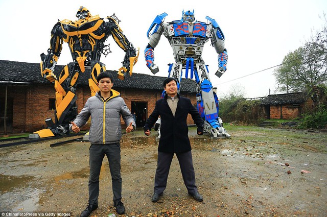 Yu Linguin has been helping his father Pu Zhilin (right) produce models of Transformers, using scrap metals from cars they have collected