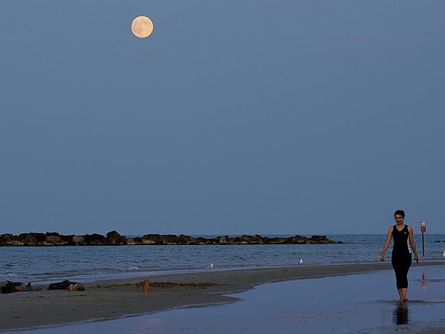 The super moon, raises over the shoreline in Roseto degli Abruzzi, Italy. AP Photo/Domeni