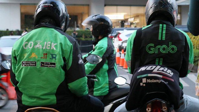 Grab và Gojek sắp hoàn tất các điều khoản sáp nhập - Ảnh 1.