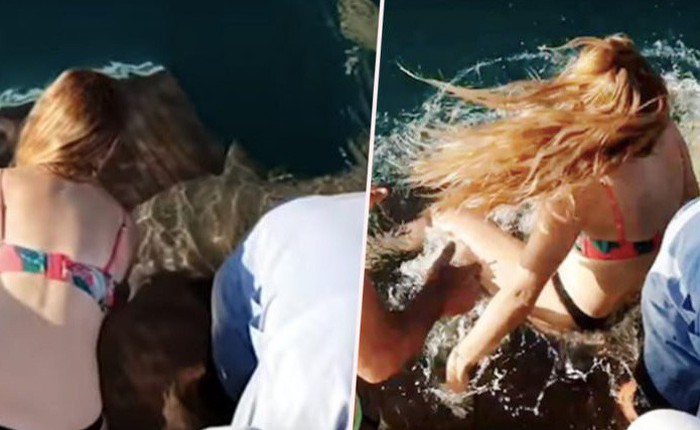 Úc: Cô gái bị lôi xuống nước, suýt mất ngón tay vì cho cá mập ăn